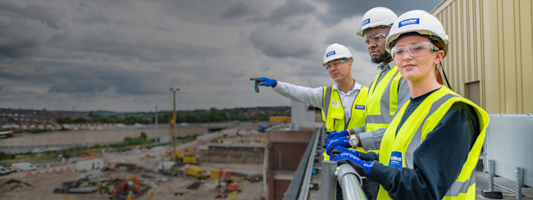 Main contractors standing on a rooftop