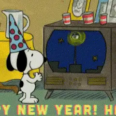Animated GIF of Snoopy from Peanuts clapping in front of a television screen displaying a New Year's celebration.