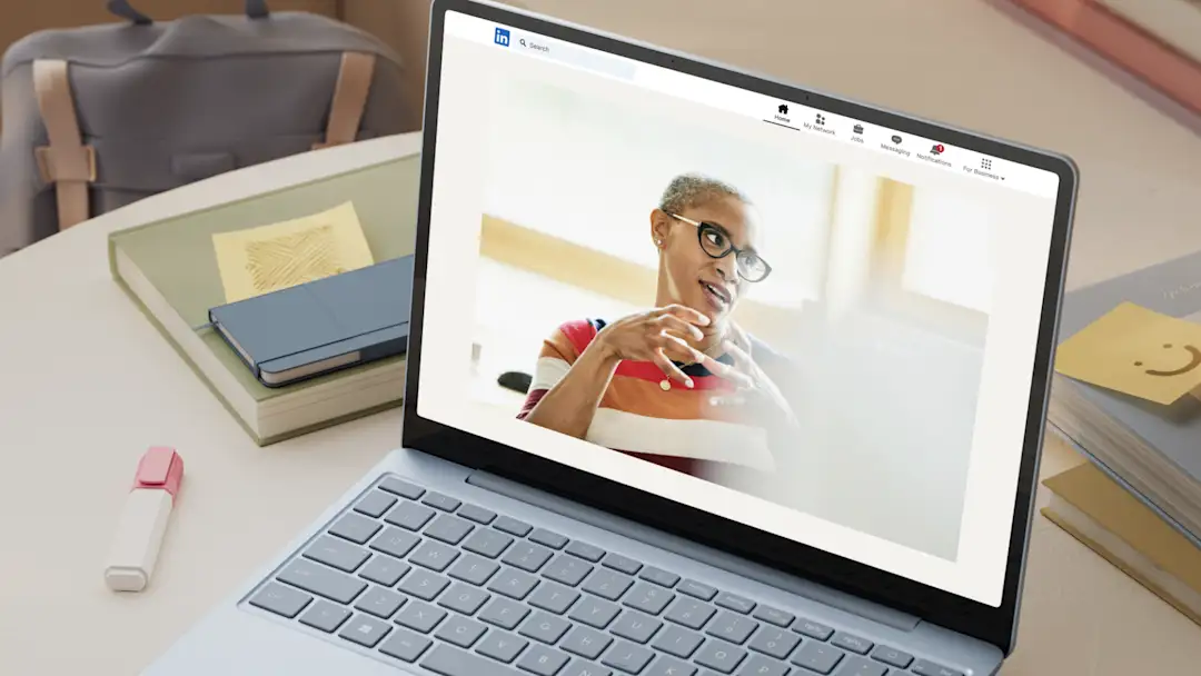 An image of a laptop with a web browser tab opened to LinkedIn.