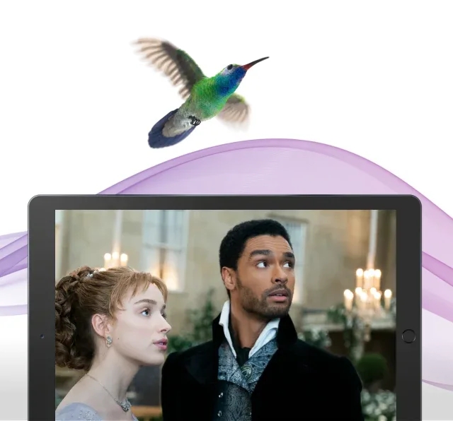 Two actors from the series Bridgerton look at something out of view.
