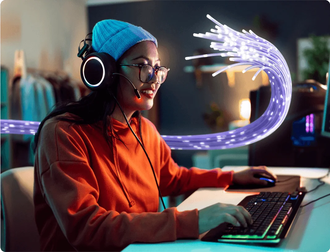 A person enjoys playing a lag-free, online video game with friends from around the world.