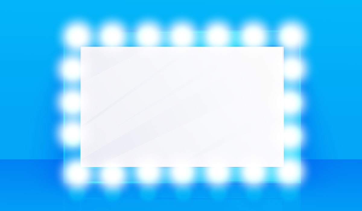 a blank mirror surrounded by lightbulbs