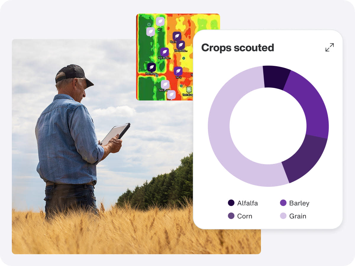 A man stands in a field, examining a tablet that shows a pie chart related to agronomy software.
